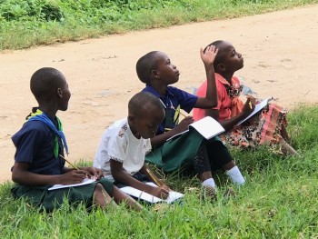 Children from Choba Primary school, carefully checking all the details so they’d be represented in their sketches